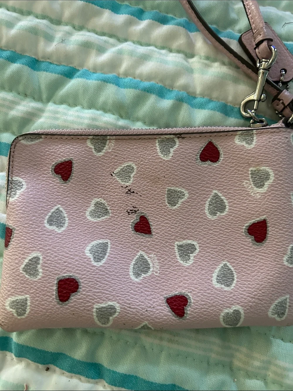 Coach Pink Leather Heart Wristlet with Red & Silver Hearts.  Two small marks